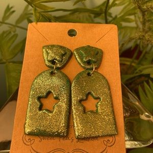 Green dangle earrings with gold glitter and star design
